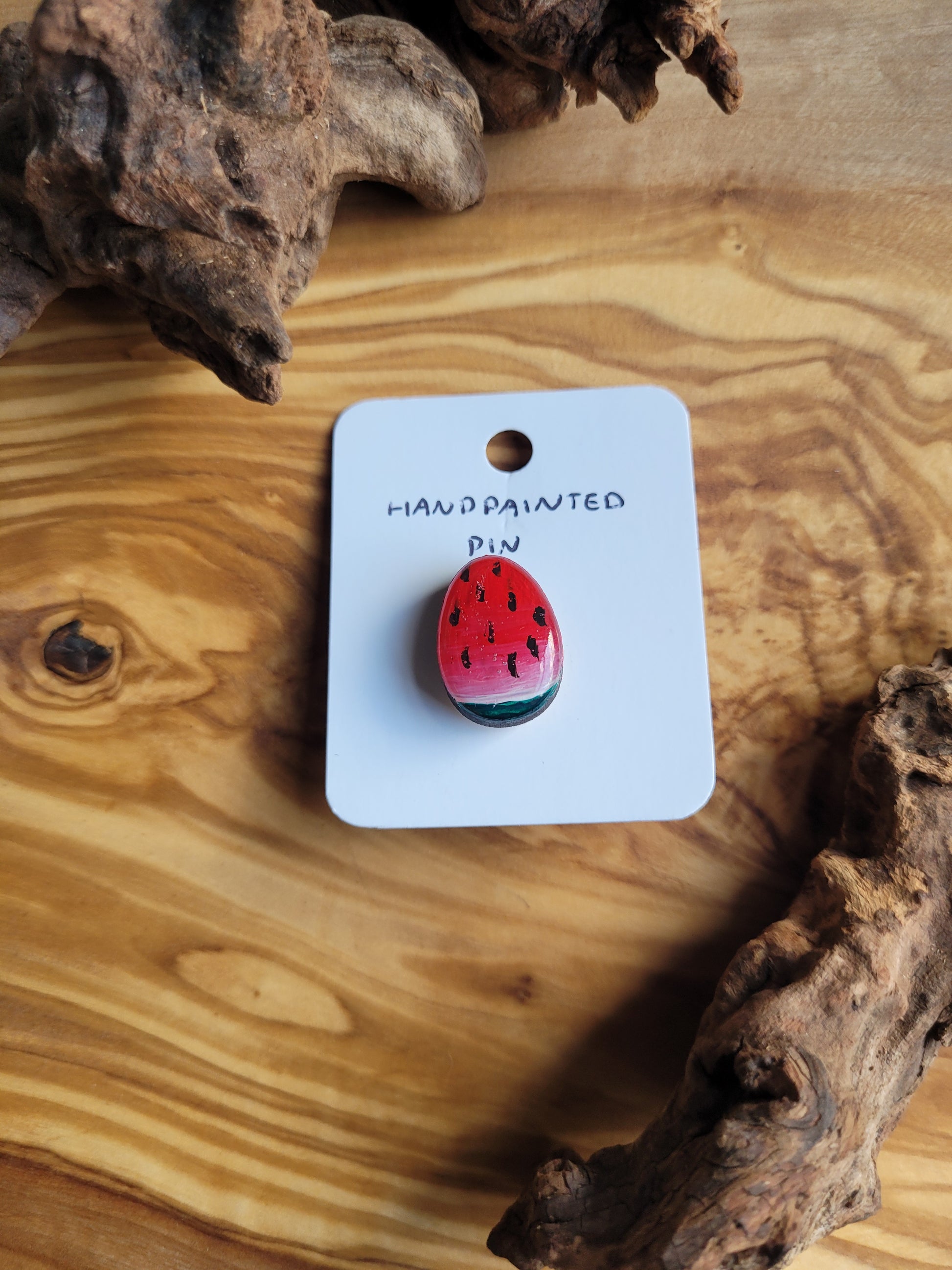 Hand-painted wooden Easter Egg shaped pin badge painted like a wedge of a watermelon slice