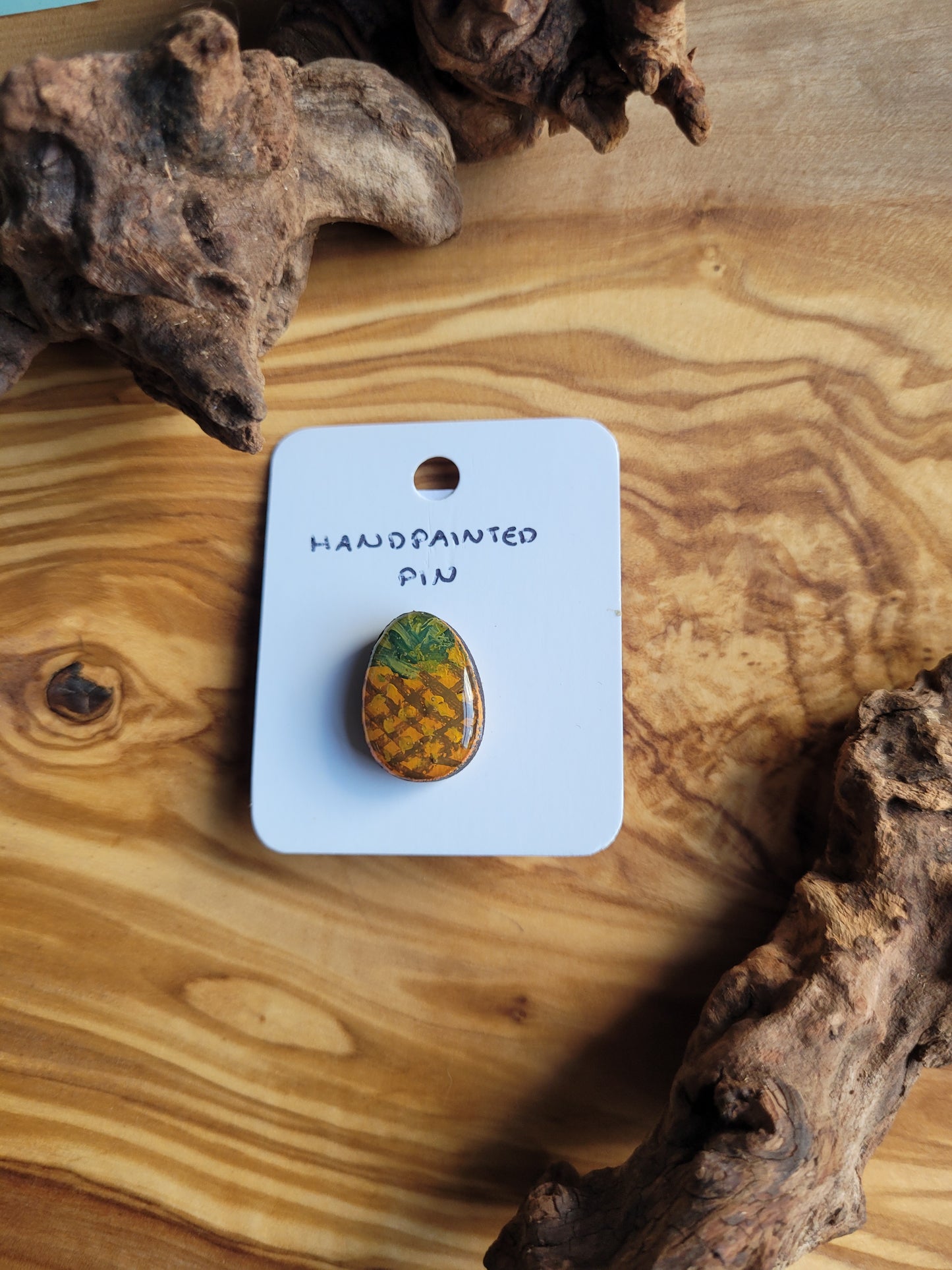 Hand-painted wooden Easter Egg shaped pin badge painted like a pineapple