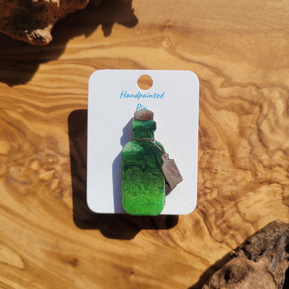Green handpainted potion bottle shaped pin