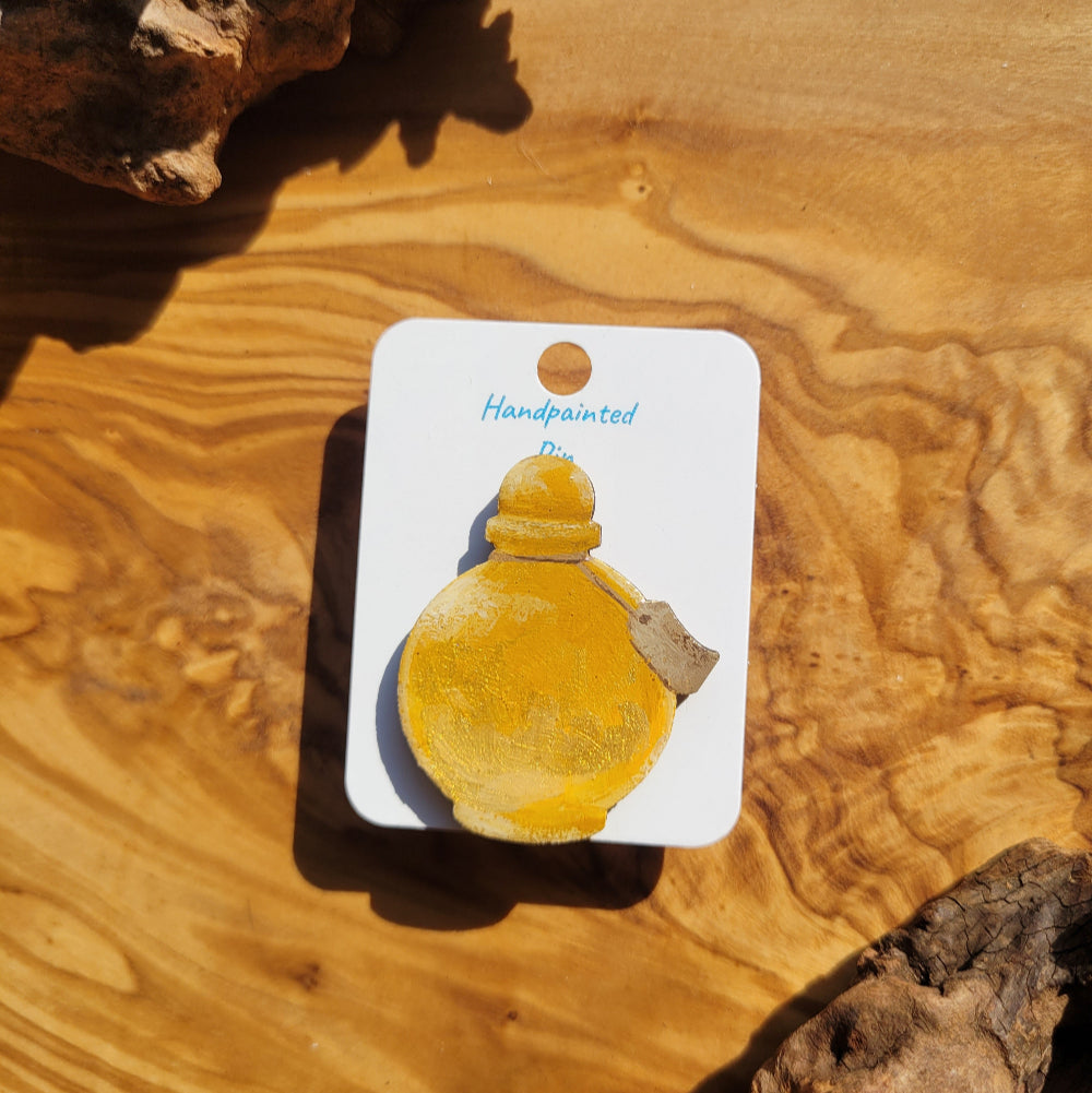 yellow-gold handpainted potion bottle shaped pin