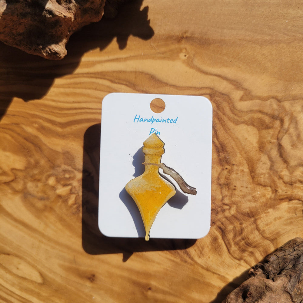 yellow-gold handpainted potion bottle shaped pin