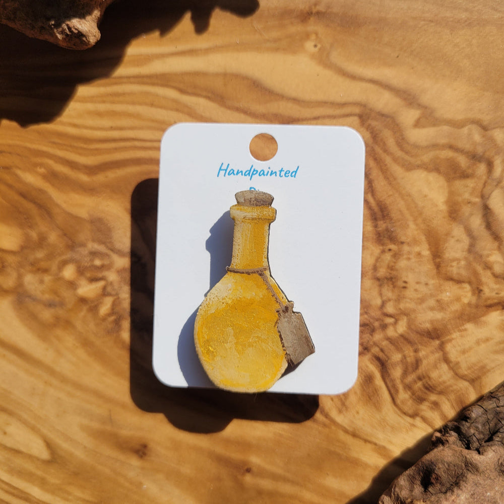yellow-gold handpainted potion bottle shaped pin