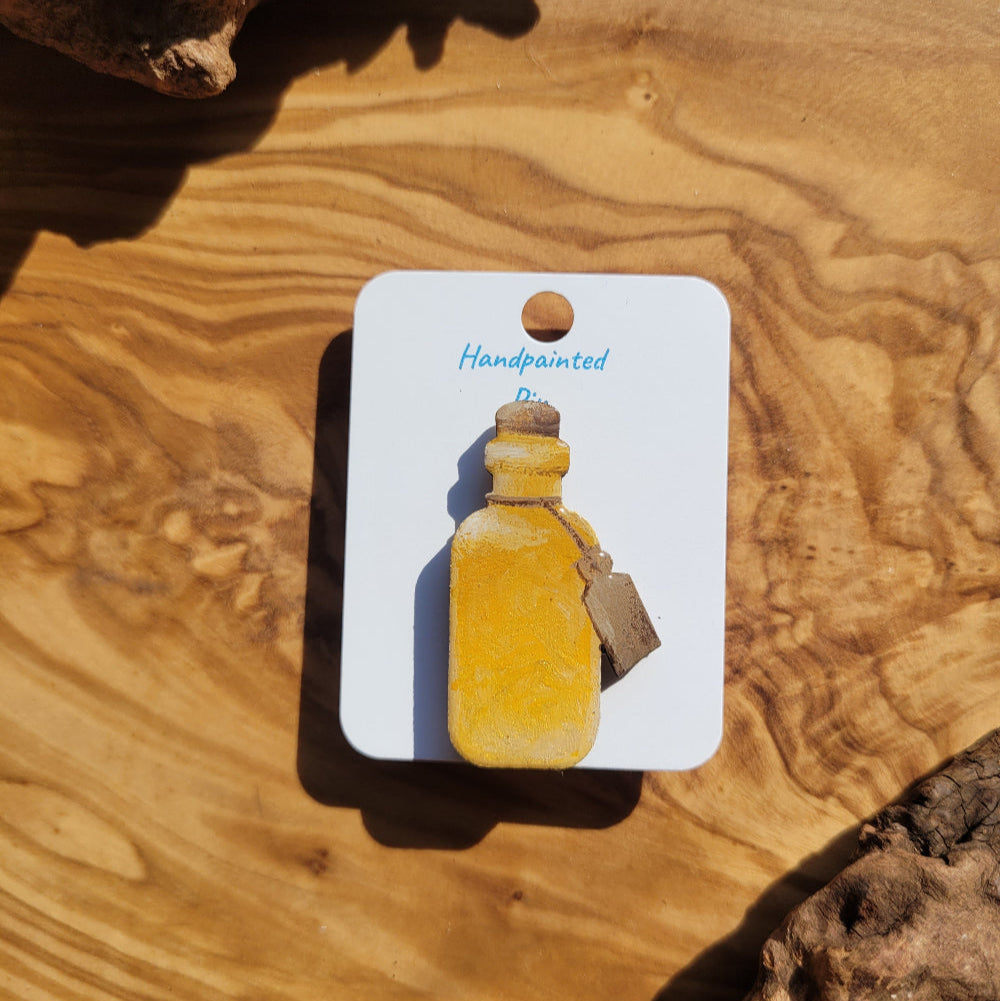 yellow-gold handpainted potion bottle shaped pin
