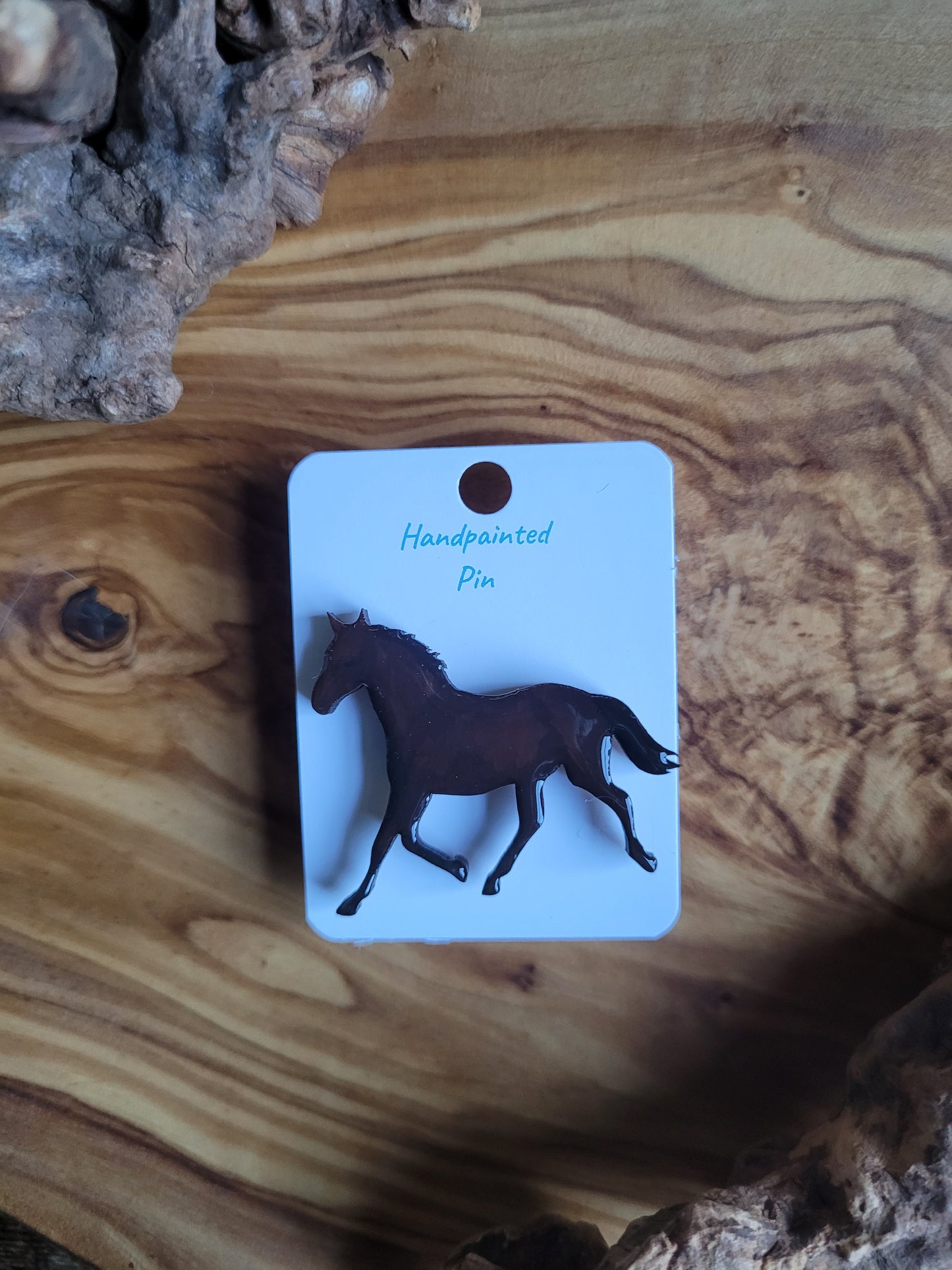 Hand-painted horse shaped wooden pin badge. Dark cherry chestnut colour