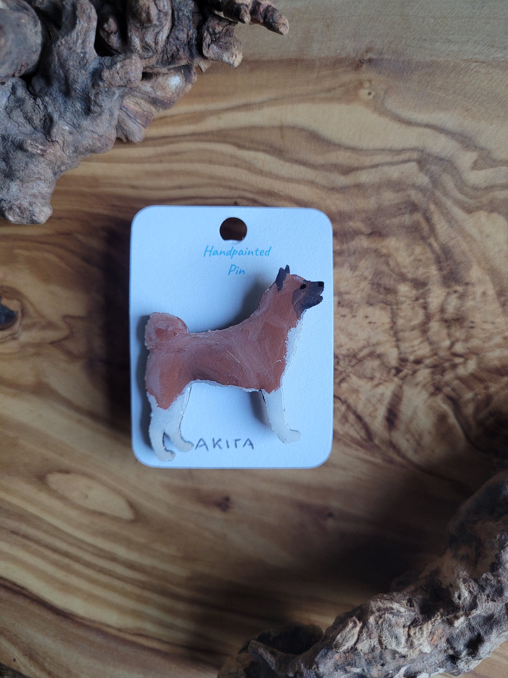 Red hand-painted Akita wooden pin badge