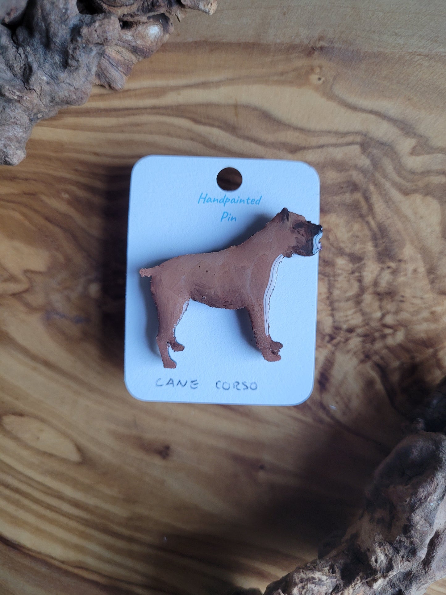 Hand-painted wooden pin badge of a fawn coloured Cane Corso dog.