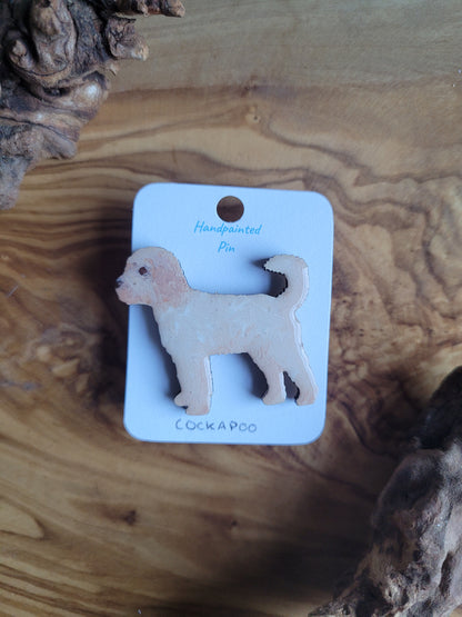 Hand-painted wooden dog pin badge of a light creamy gold coloured Cockapoo