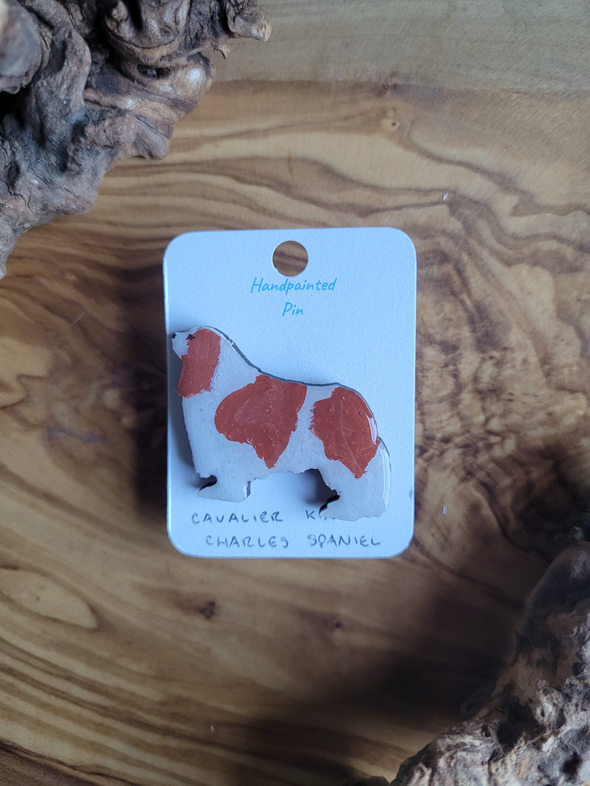 Hand-painted red and white coloured Cavalier King Charles Spaniel wooden pin badge