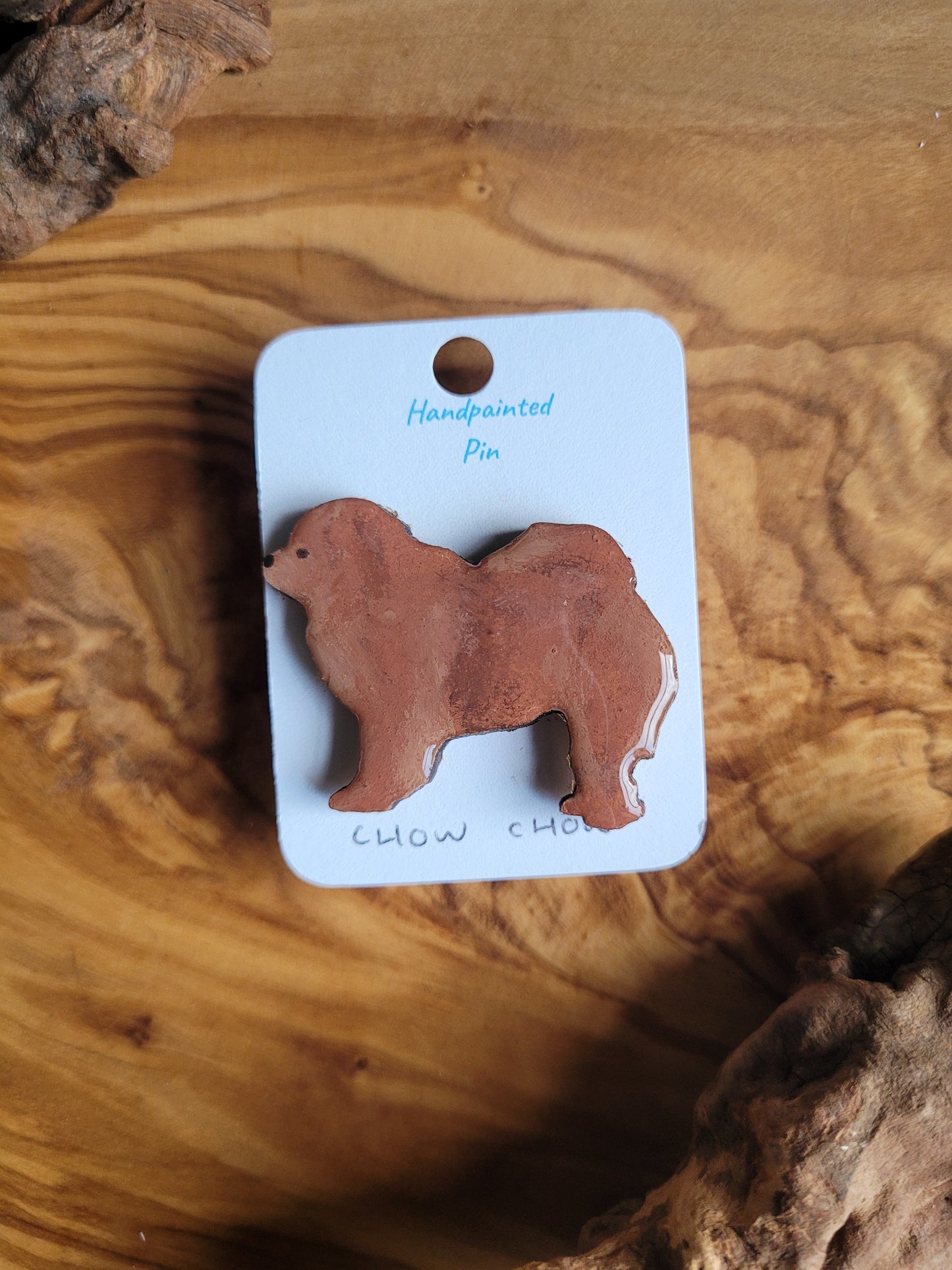 Hand-painted on wooden, red coloured Chow Chow dog pin badge