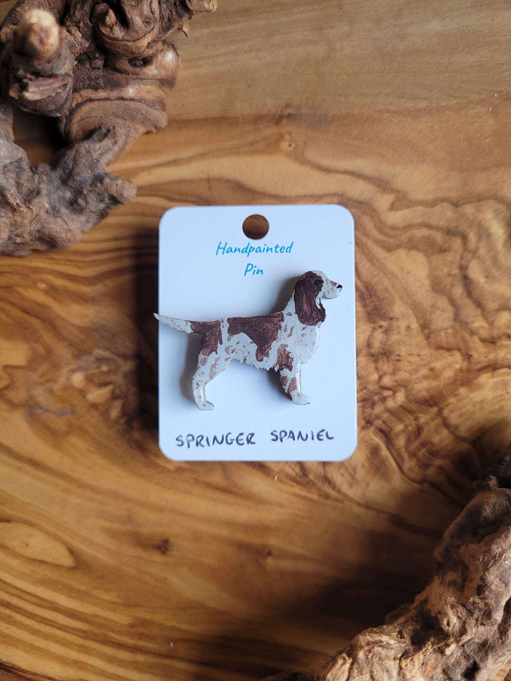 Hand-painted wooden dog pin badge of an English Springer Spaniel, liver and white speckled colour