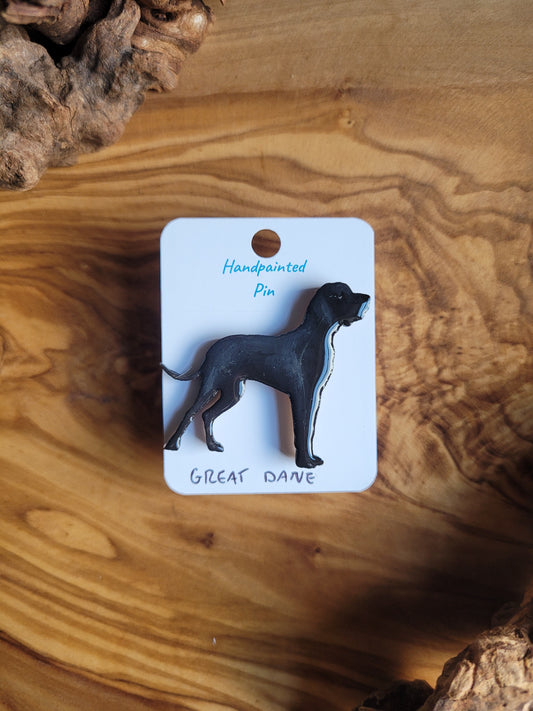 Hand-painted wooden pin badge of a black Great Dane