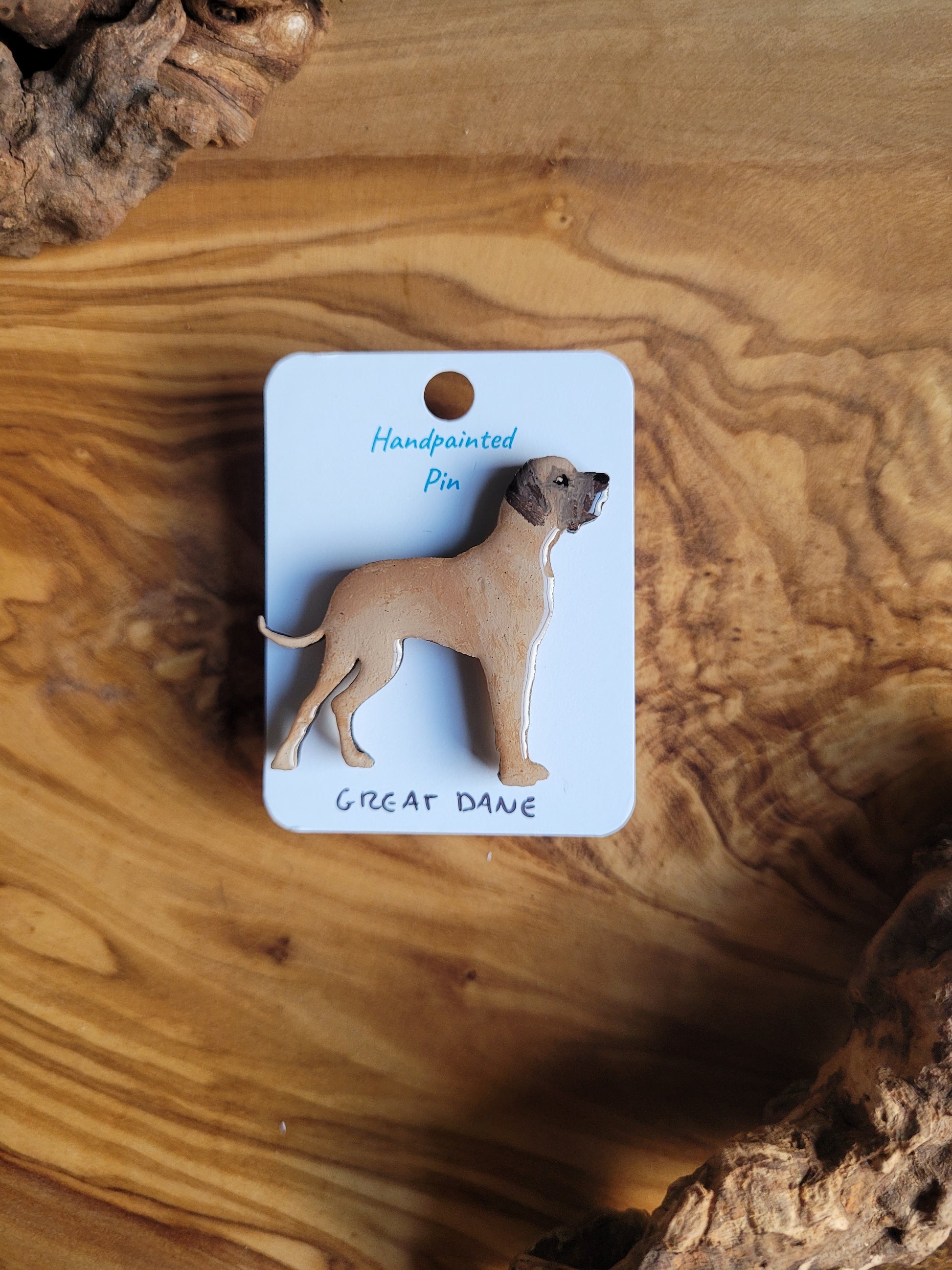 Hand-painted wooden pin badge of a fawn Great Dane