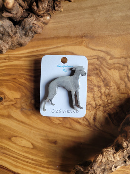 Hand-painted Greyhound pin badge, painted onto wood. Blue colour greyhound