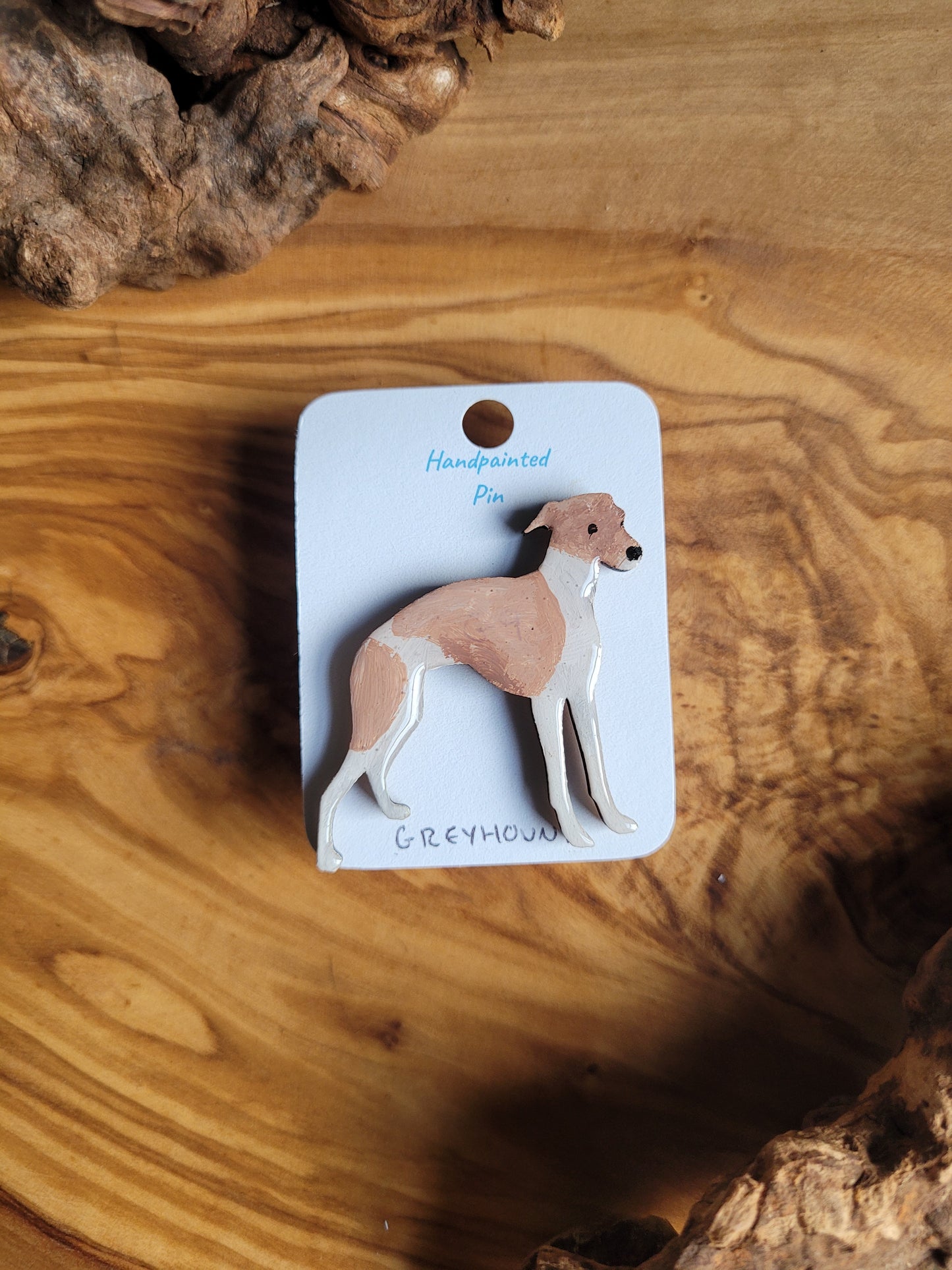 Hand-painted Greyhound pin badge, painted onto wood. White and fawn 