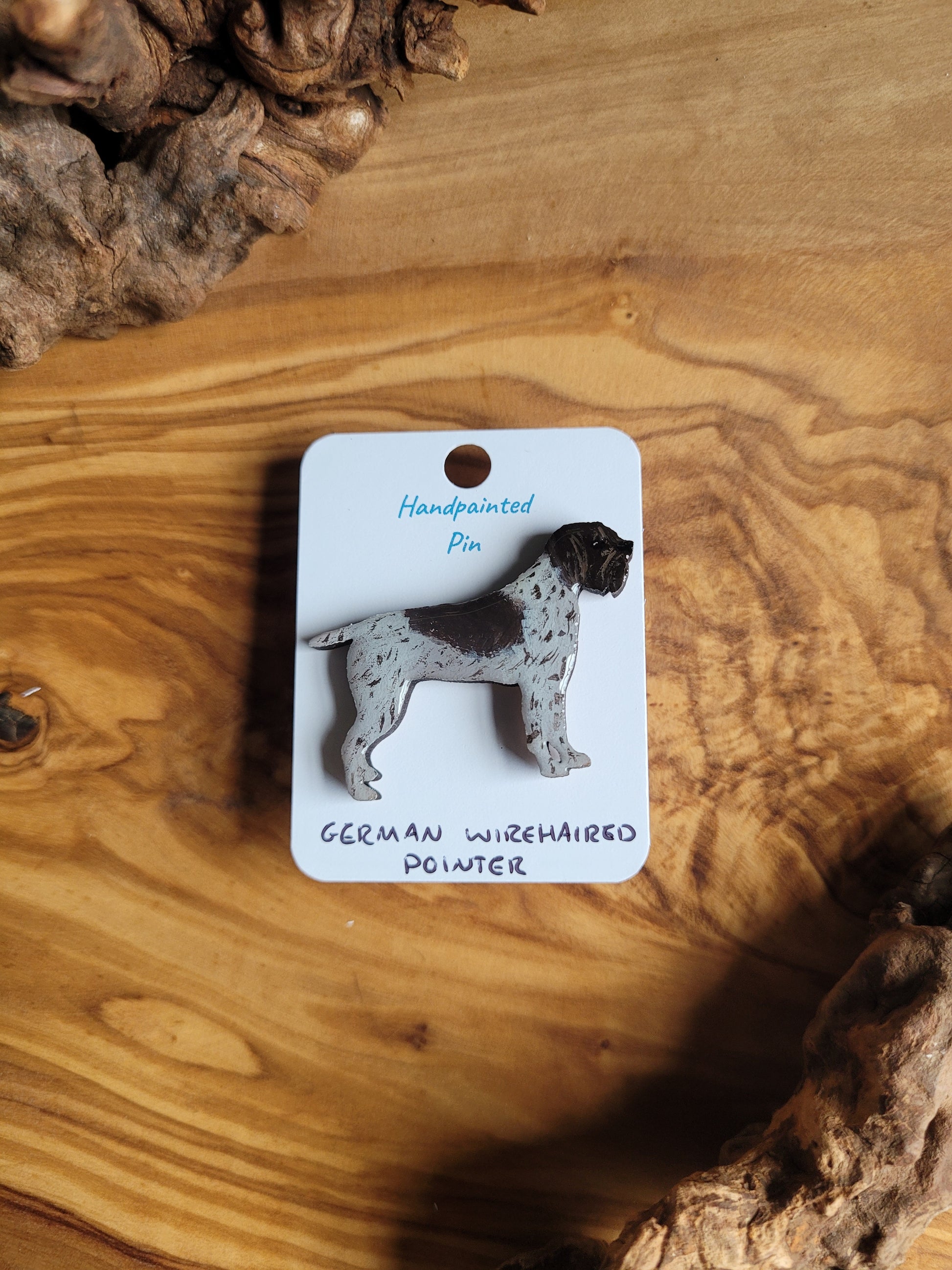 Hand-painted German Wirehaired Pointer pin badge, classic liver and white speckled with patch over the face and a saddle like patch on the back