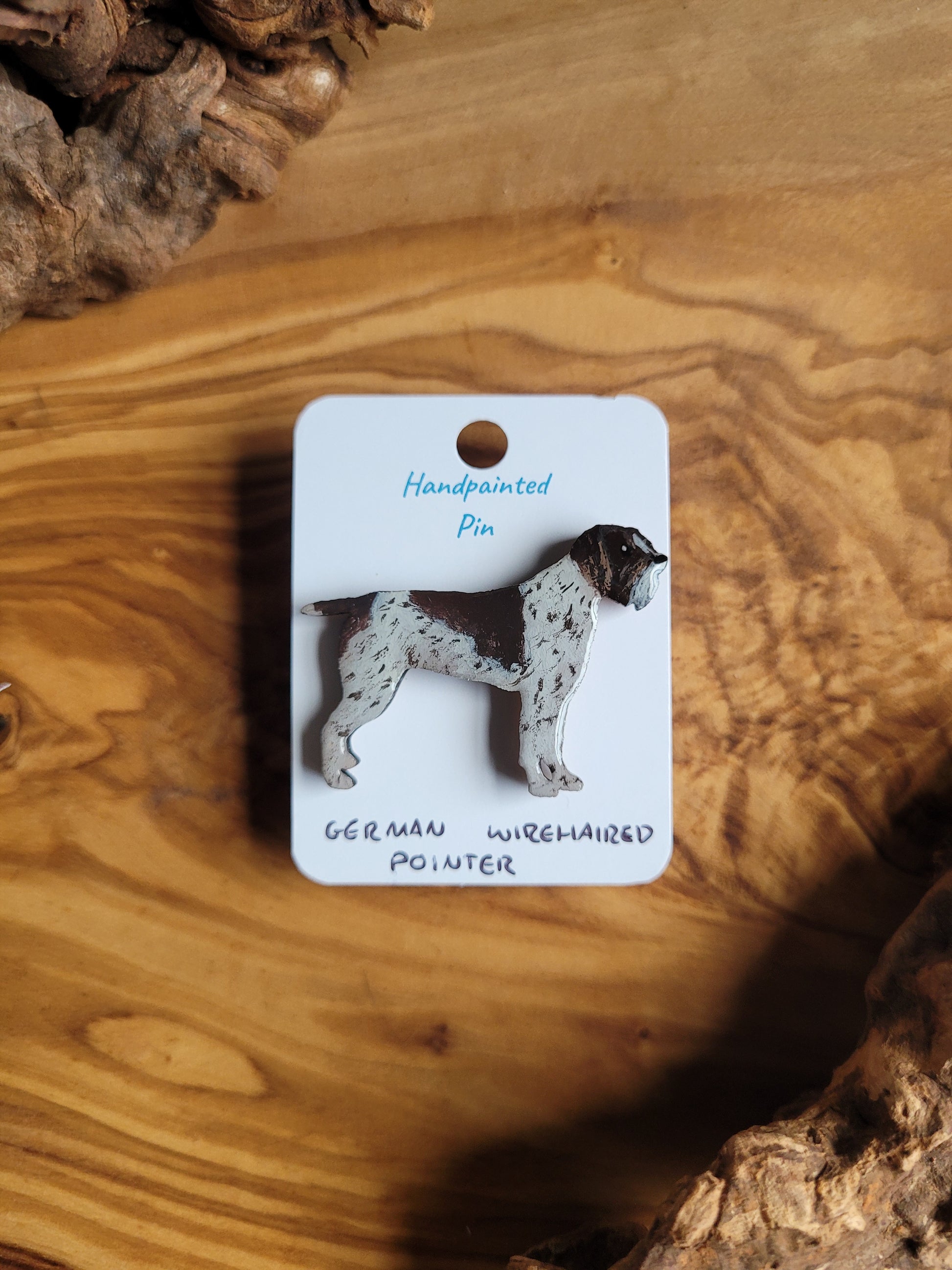 Hand-painted German Wirehaired Pointer pin badge, classic liver and white speckled with patch over the face with a saddle patch on the back and small patch towards the tail