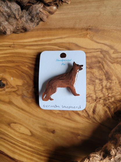 Hand-painted wooden German shepherd pin badge, black and red coloured shepherd