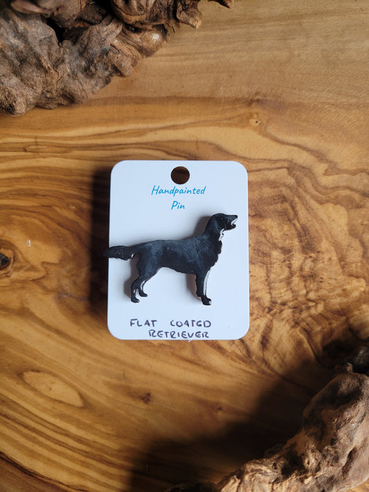Black hand-painted wooden dog pin badge of the Flat Coated Retriever