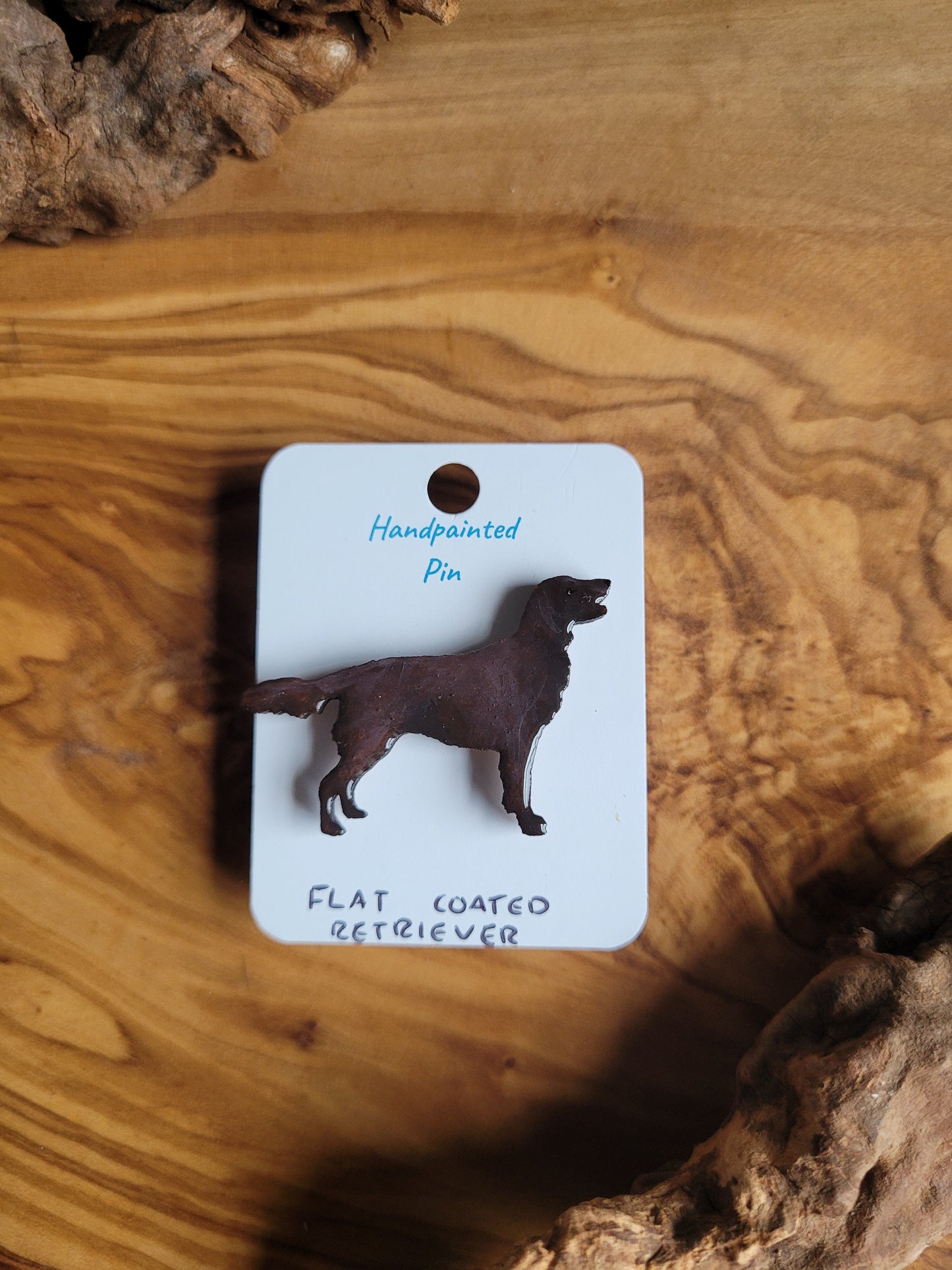 Chocolate hand-painted wooden dog pin badge of the Flat Coated Retriever