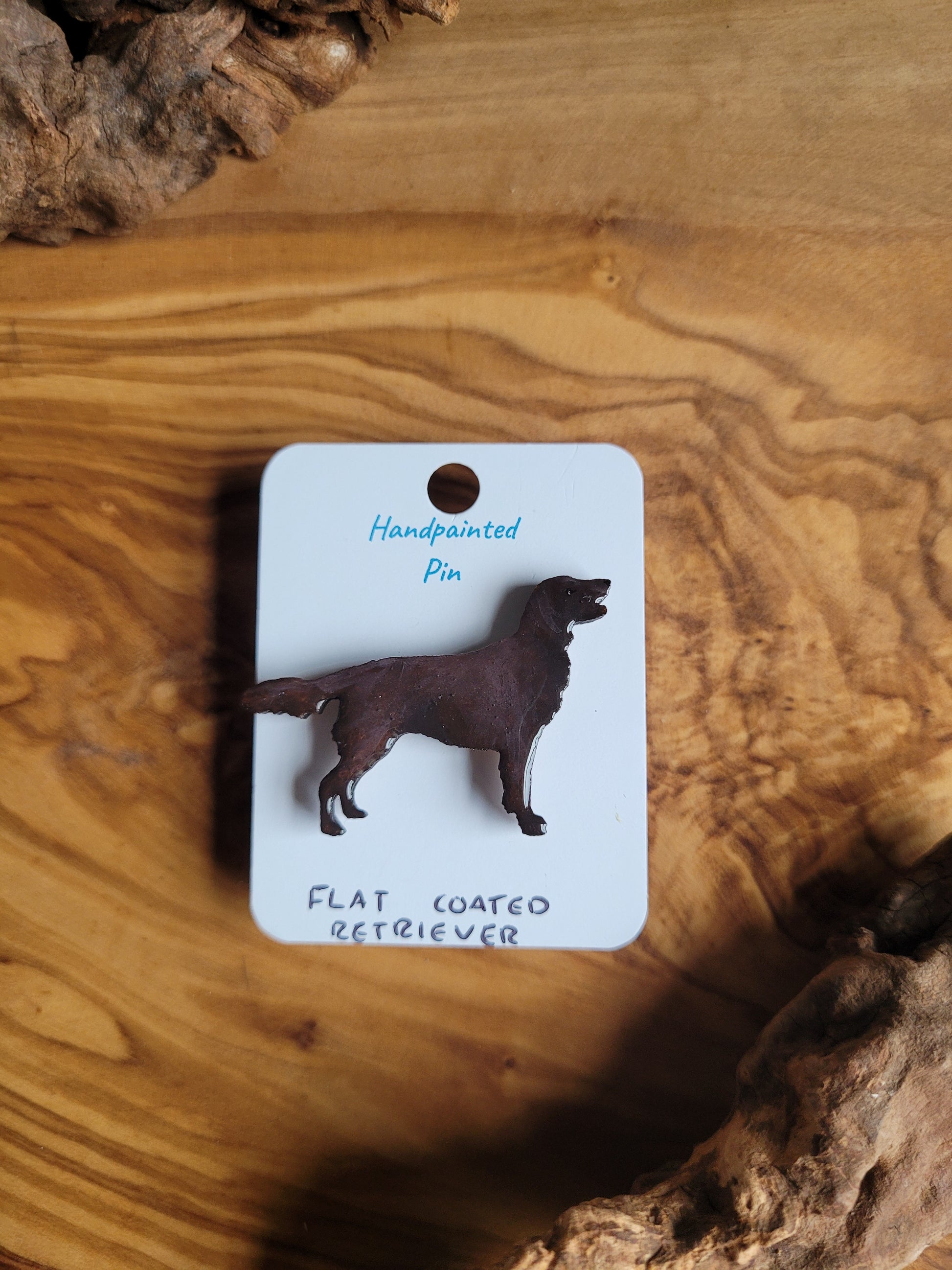 Chocolate hand-painted wooden dog pin badge of the Flat Coated Retriever