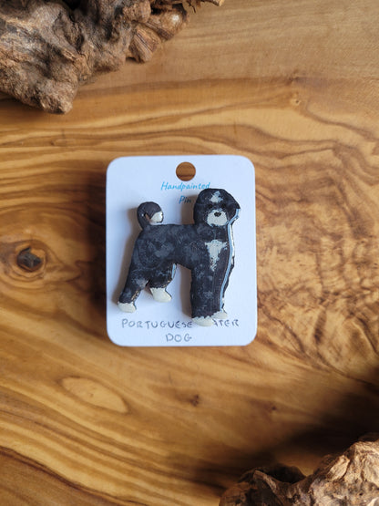 Hand-painted Portuguese Water Dog pin badge, painted onto wood. Black and white colour.