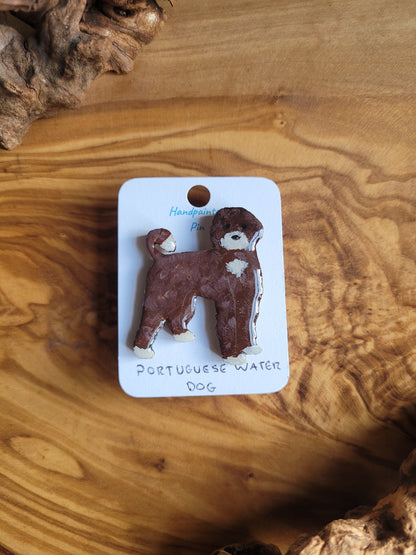 Hand-painted Portuguese Water Dog pin badge, painted onto wood. Chocolate and white colour.