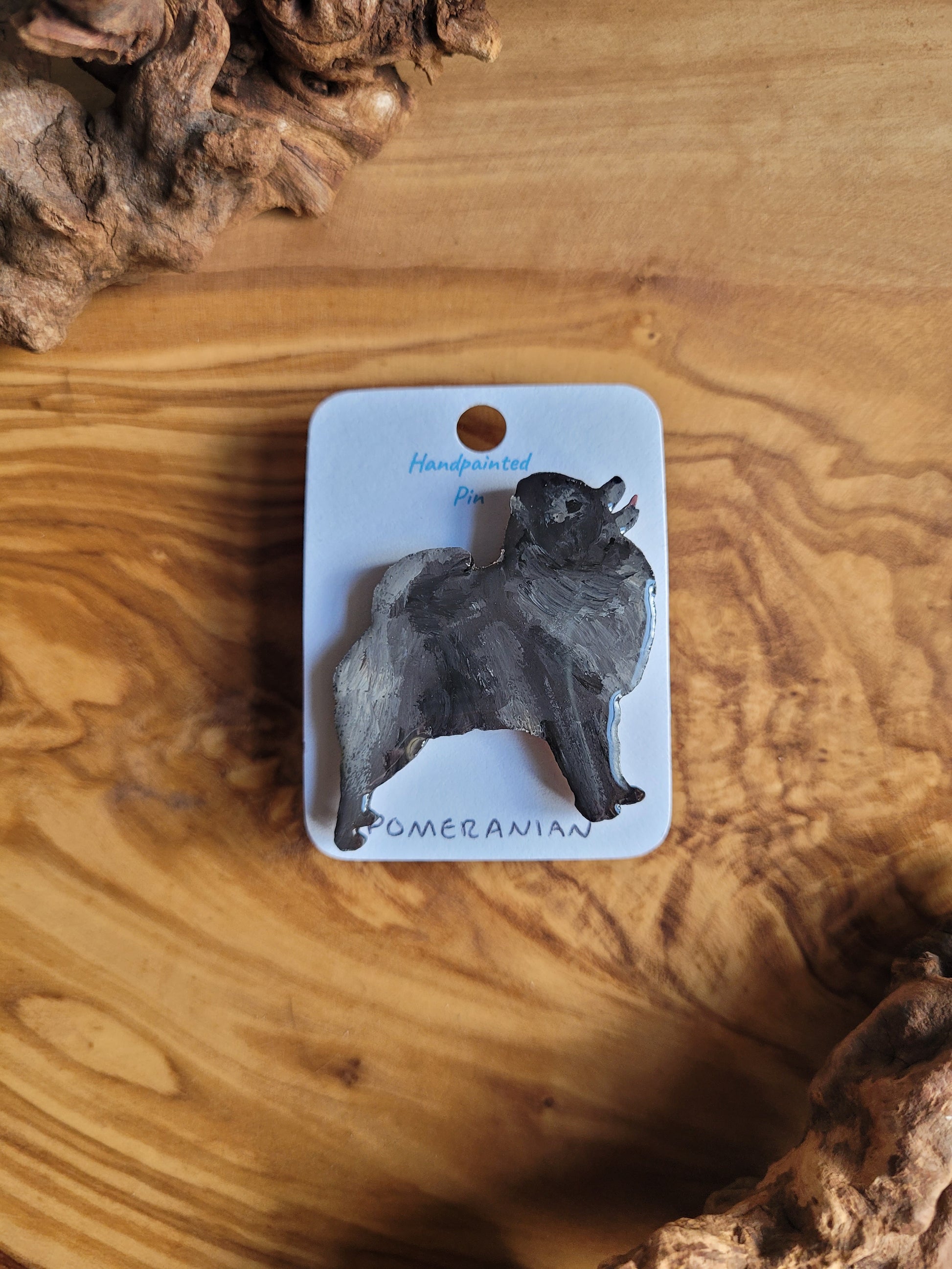 Black coloured hand-painted Pomeranian wooden pin badge