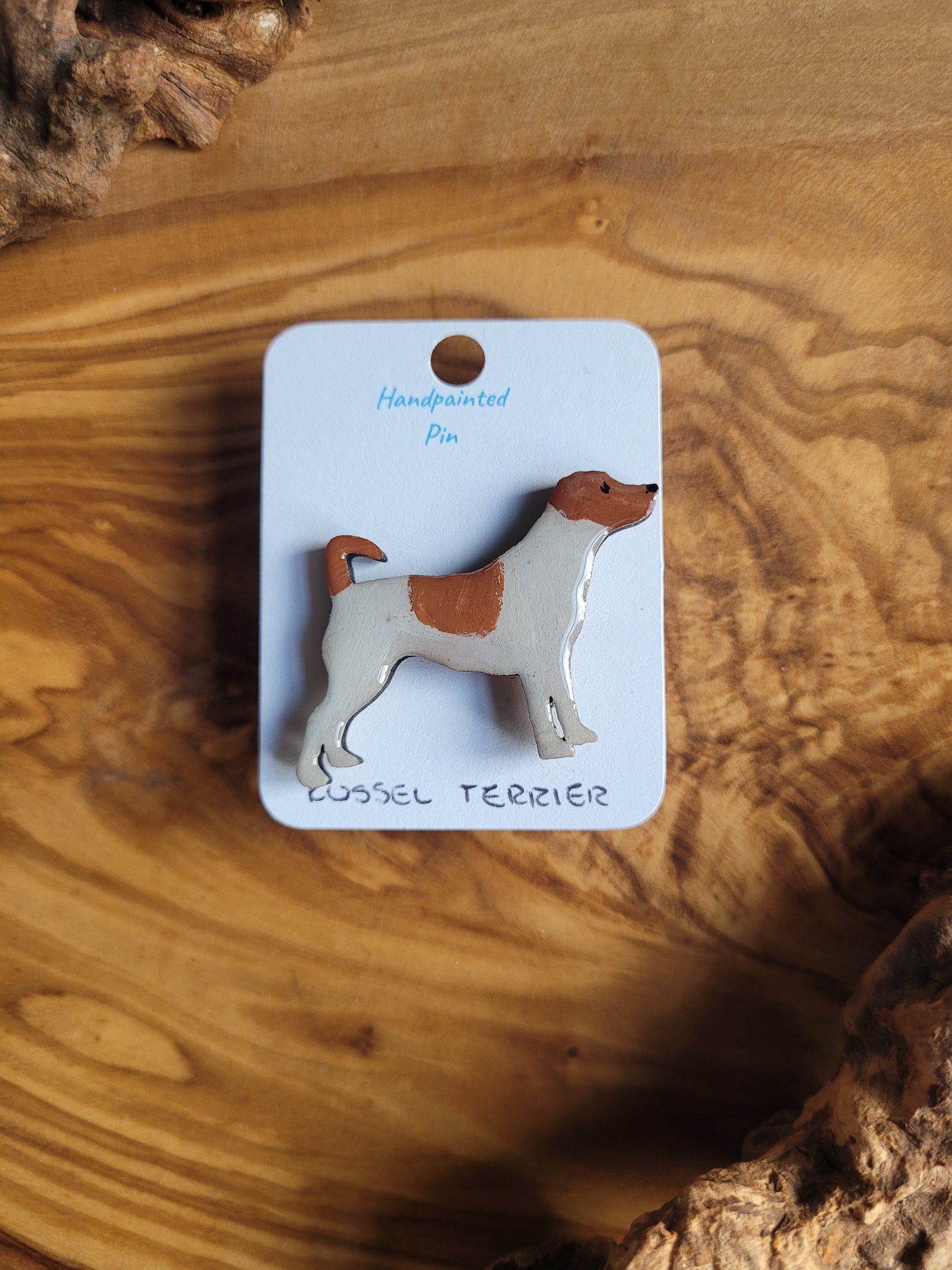 White and tan patches, hand-painted wooden pin badge of a Russel Terrier dog