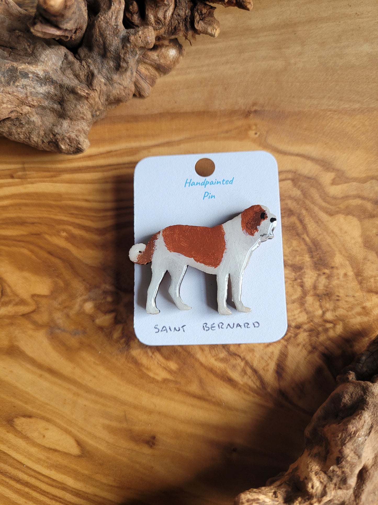 Hand-painted dog pin badge of the iconic Saint Bernard (beethoven/rescue dog) White with a red saddle and ears
