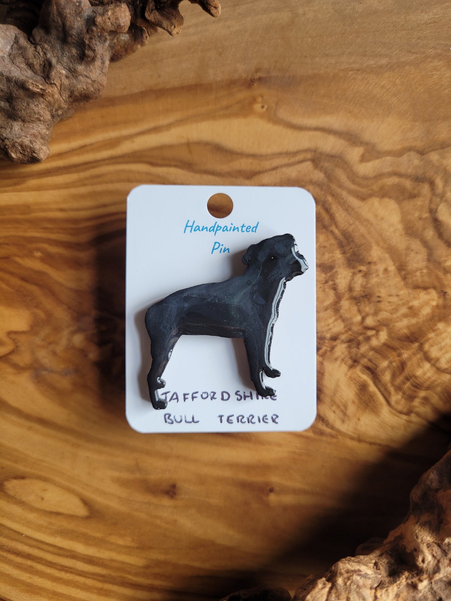 Hand-painted staffordshire bull terrier dog pin badge, painted onto wood. Black colour