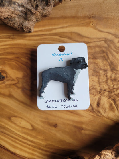 Hand-painted staffordshire bull terrier dog pin badge, painted onto wood. Black with white cheat and paws colour