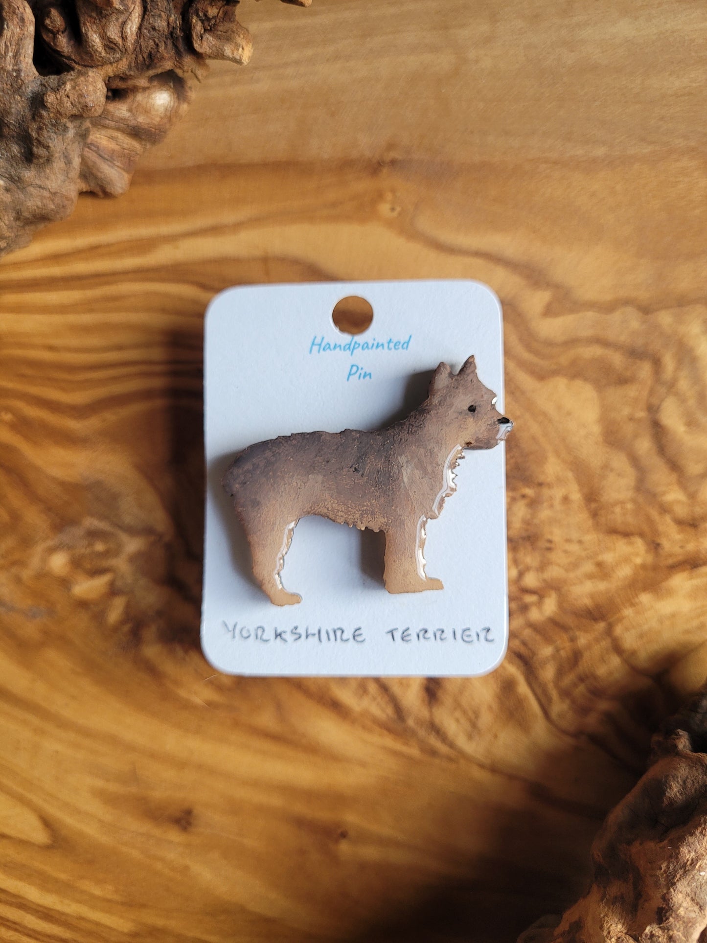 Black and tan coloured wooden dog pin badge of the Yorkshire Terrier