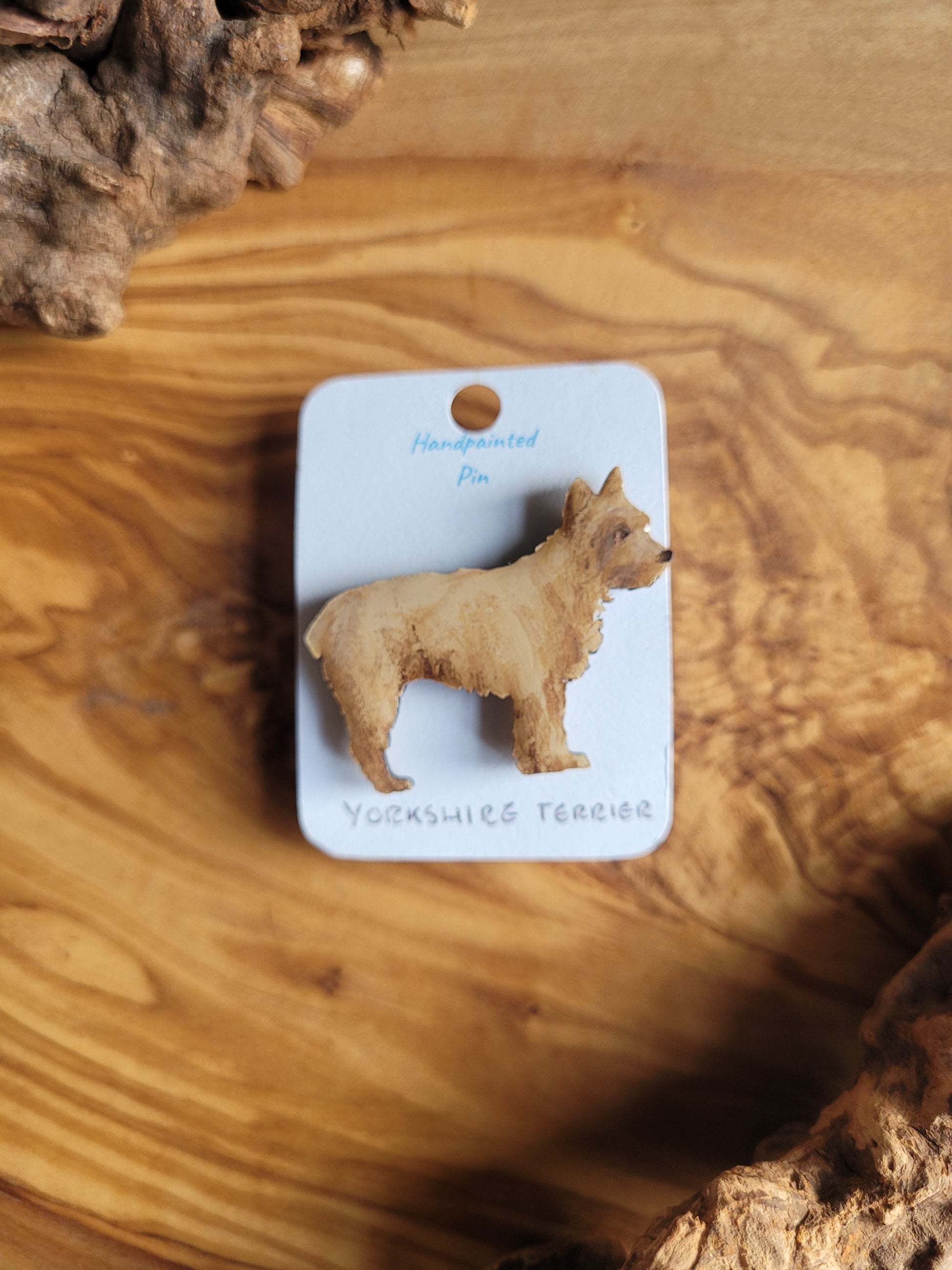 Tan coloured wooden dog pin badge of the Yorkshire Terrier