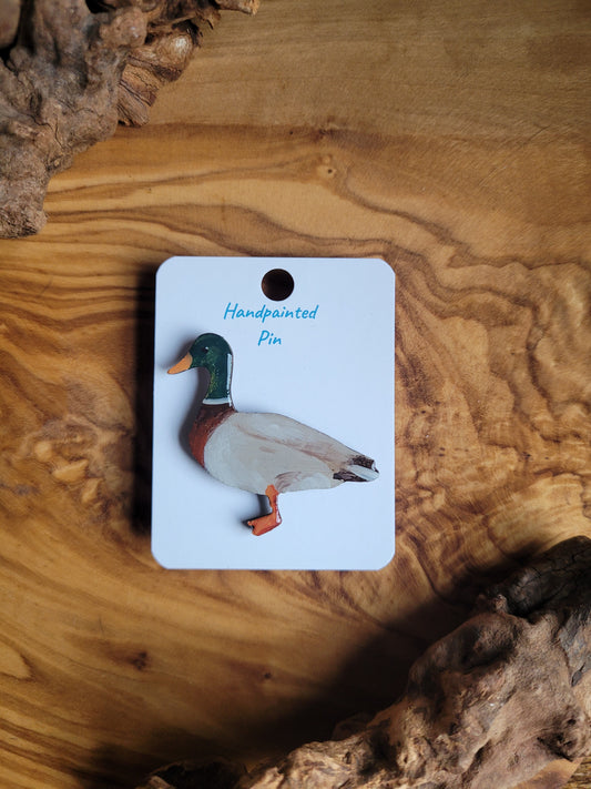 Hand-painted wooden pin badge of a male mallard duck