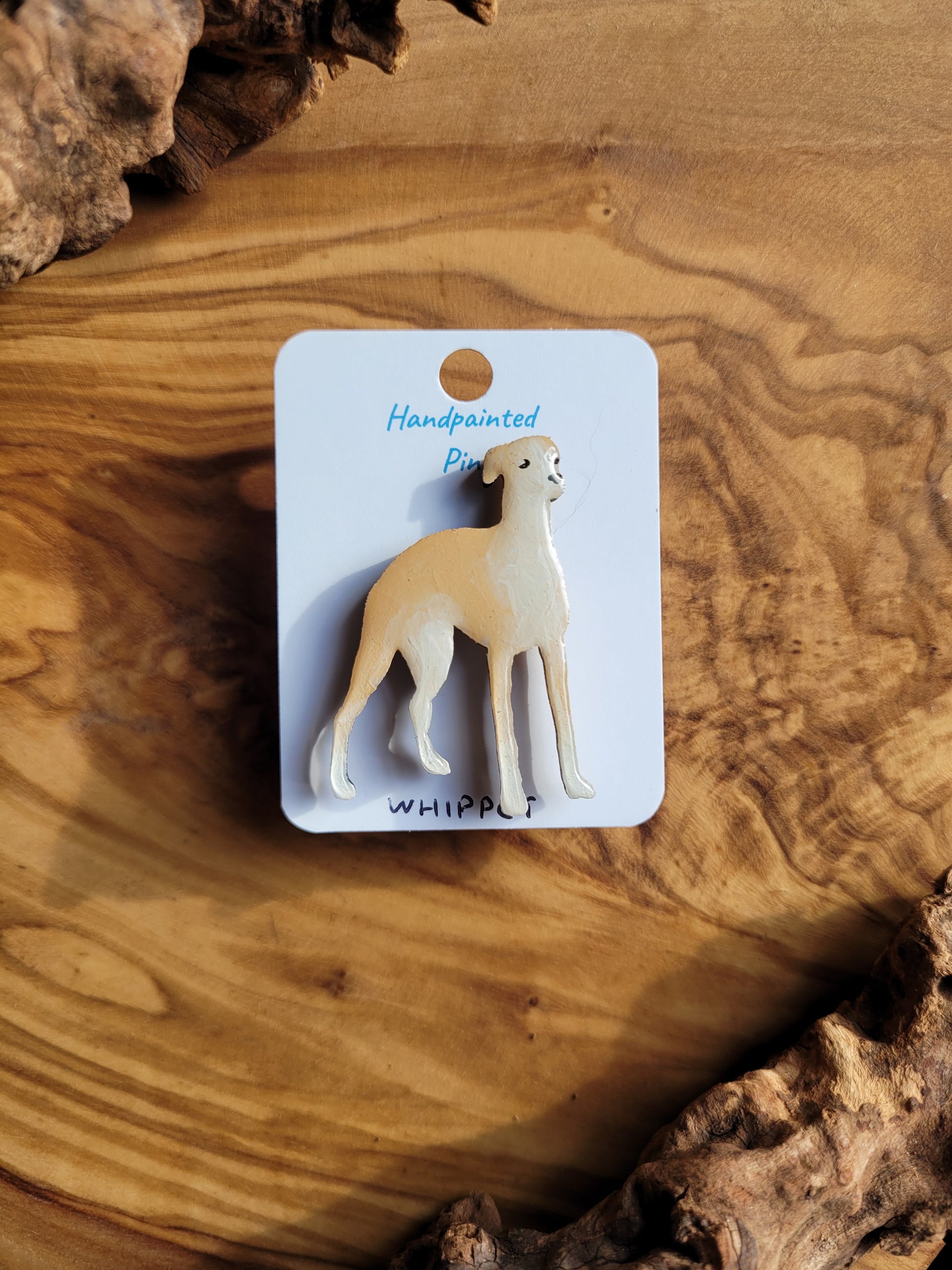 Hand-painted wooden dog pin badge of the Whippet hound. Fawn and white