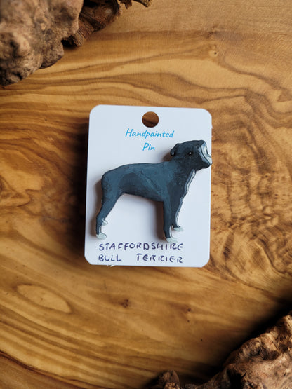 Hand-painted staffordshire bull terrier dog pin badge, painted onto wood. Blue colour with white paws
