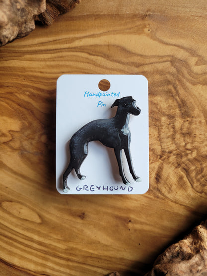 Hand-painted Greyhound pin badge, painted onto wood. Black and white small patch on the chest and paws