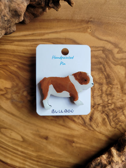 Hand-painted wooden dog pin of a red and white bulldog