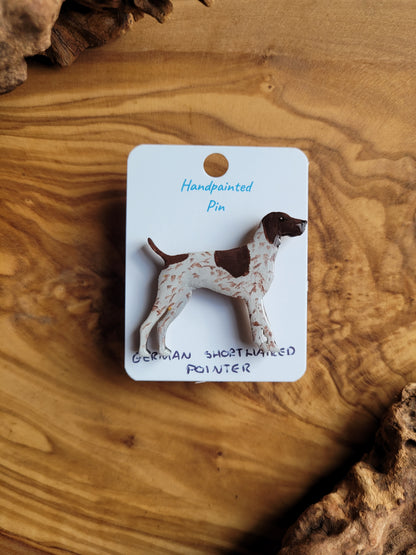 Hand-painted wooden dog pin of a German Shorthaired Pointer, white speckled with a liver patch over the head, back and tail