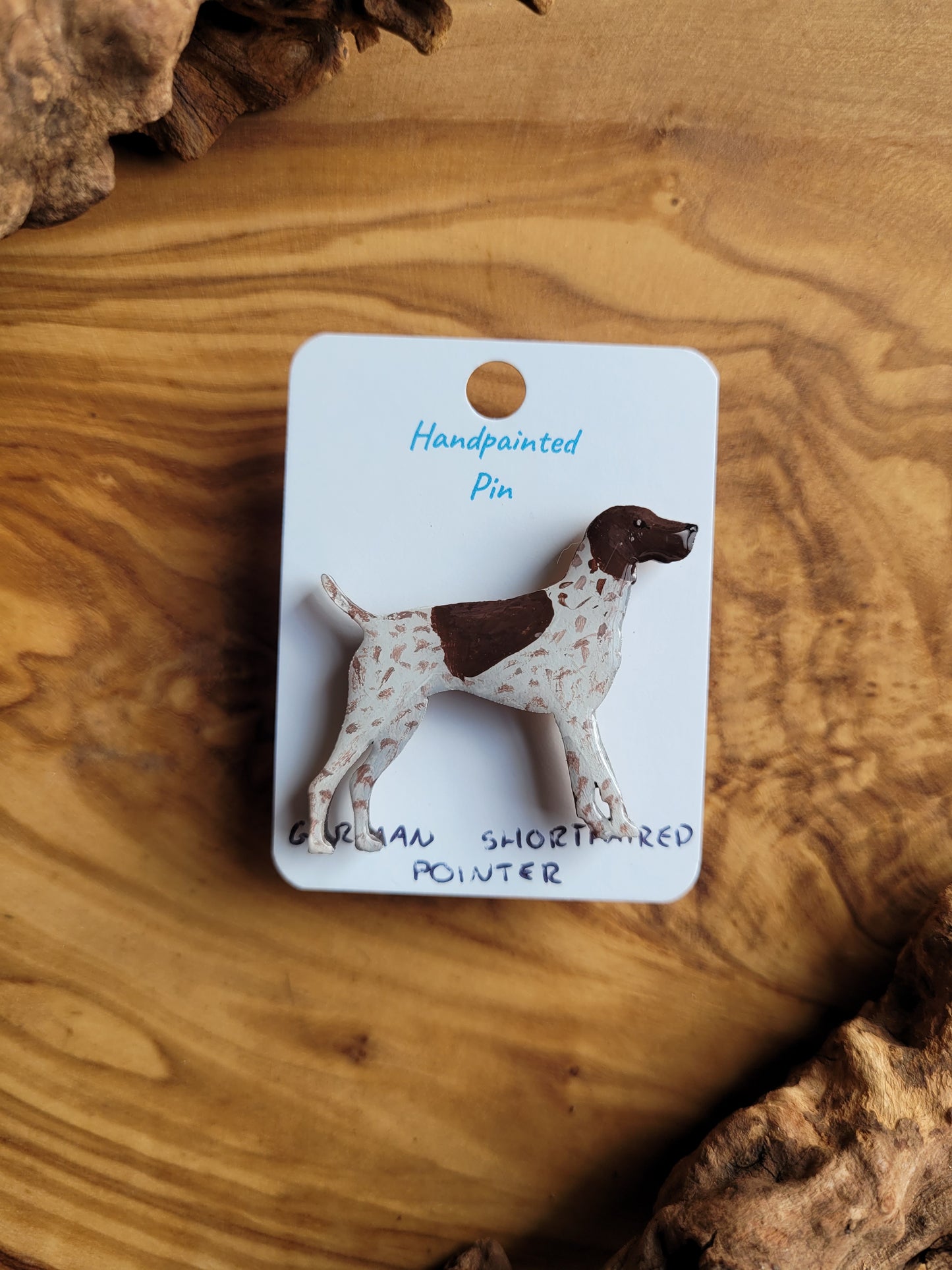 Hand-painted wooden dog pin of a German Shorthaired Pointer, white speckled with a liver patch over the head and back