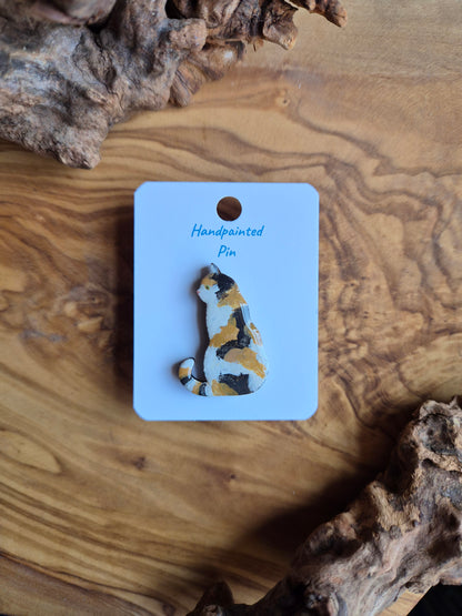 Hand-painted wooden cat pin badge. White diluted calico coloured cat