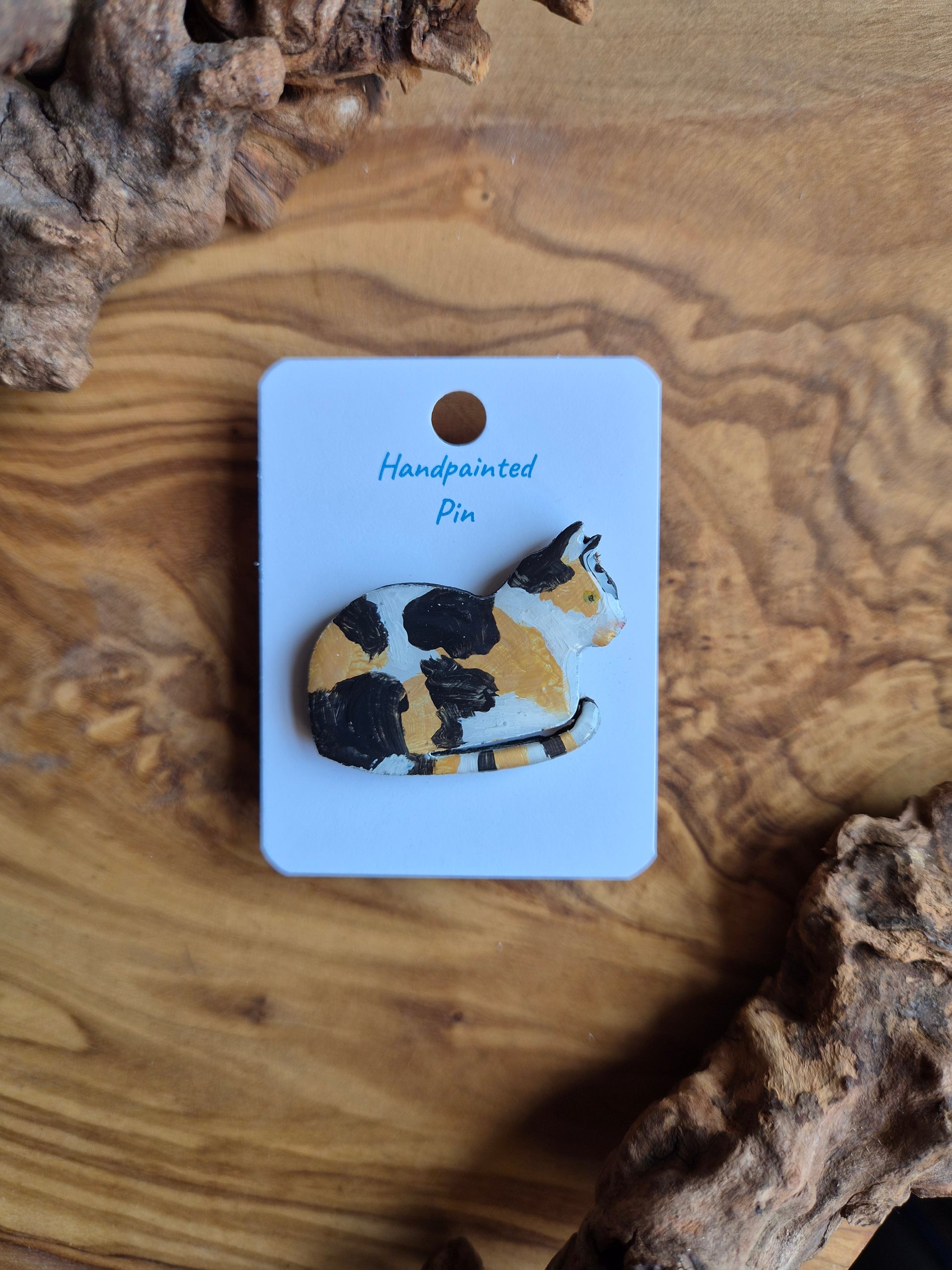Hand-painted wooden cat pin badge. White dillute Calico curled up cat
