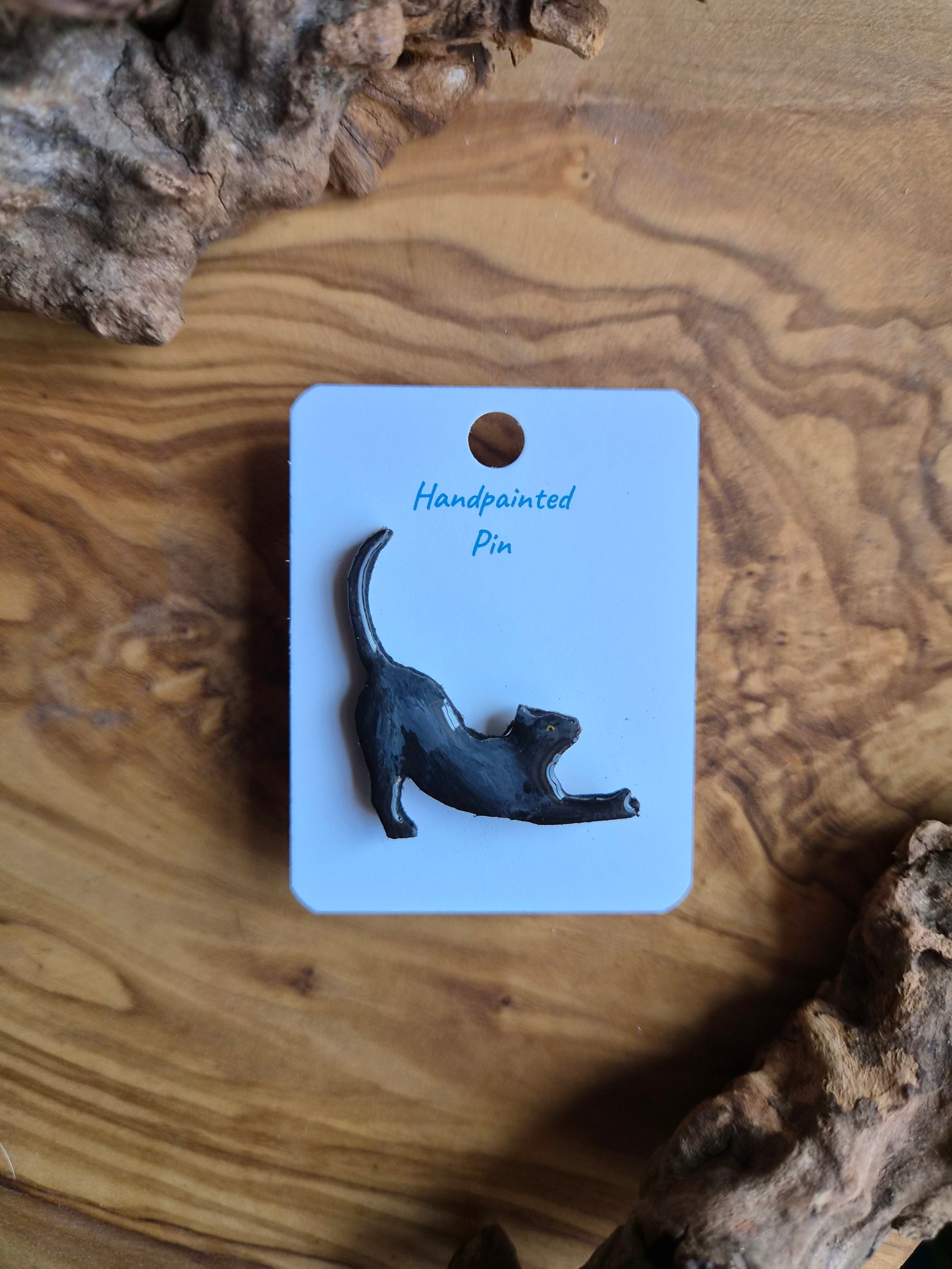 Hand-painted wooden cat pin badge. Black sleek cat