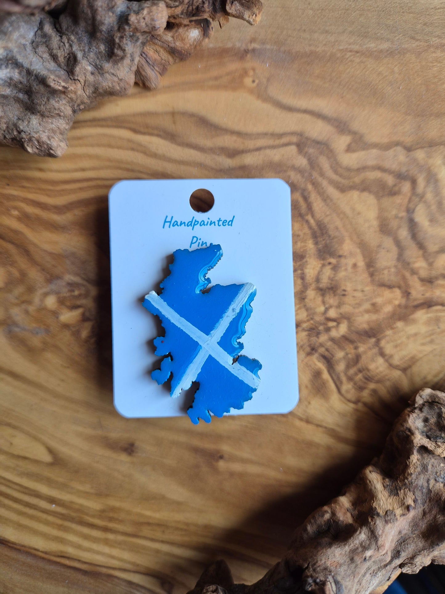 Hand-painted Scotland shaped wooden pin badge with a scottish soltaire flag painted on