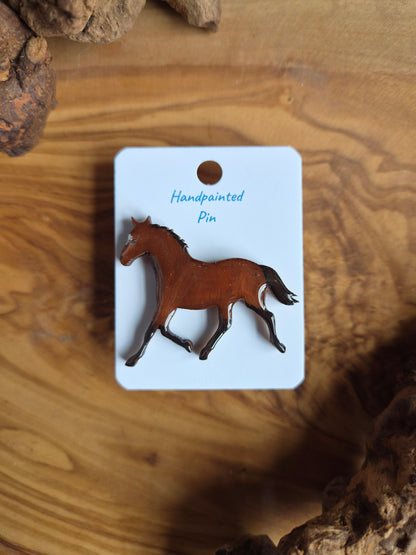 Hand-painted horse shaped wooden pin badge.  Cherry bay with a white star colour