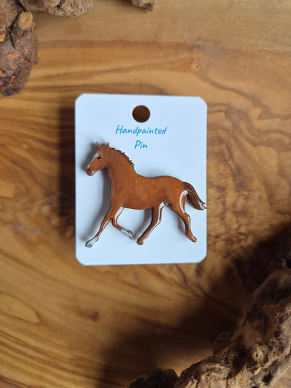 Hand-painted horse shaped wooden pin badge.  Chestnut with 2 white socks and a blaze colour