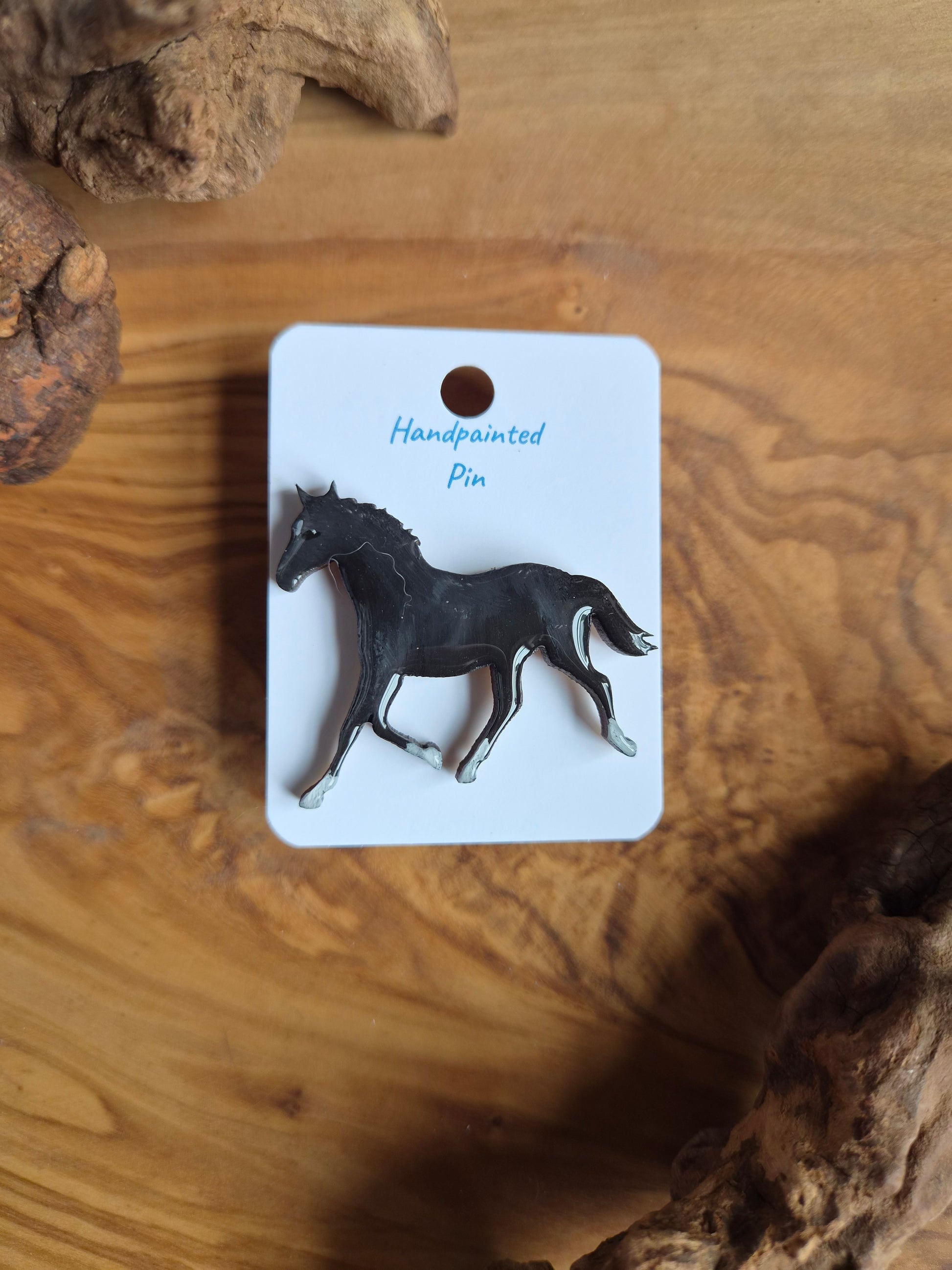 Hand-painted horse shaped wooden pin badge.  Black and white socks and star colour
