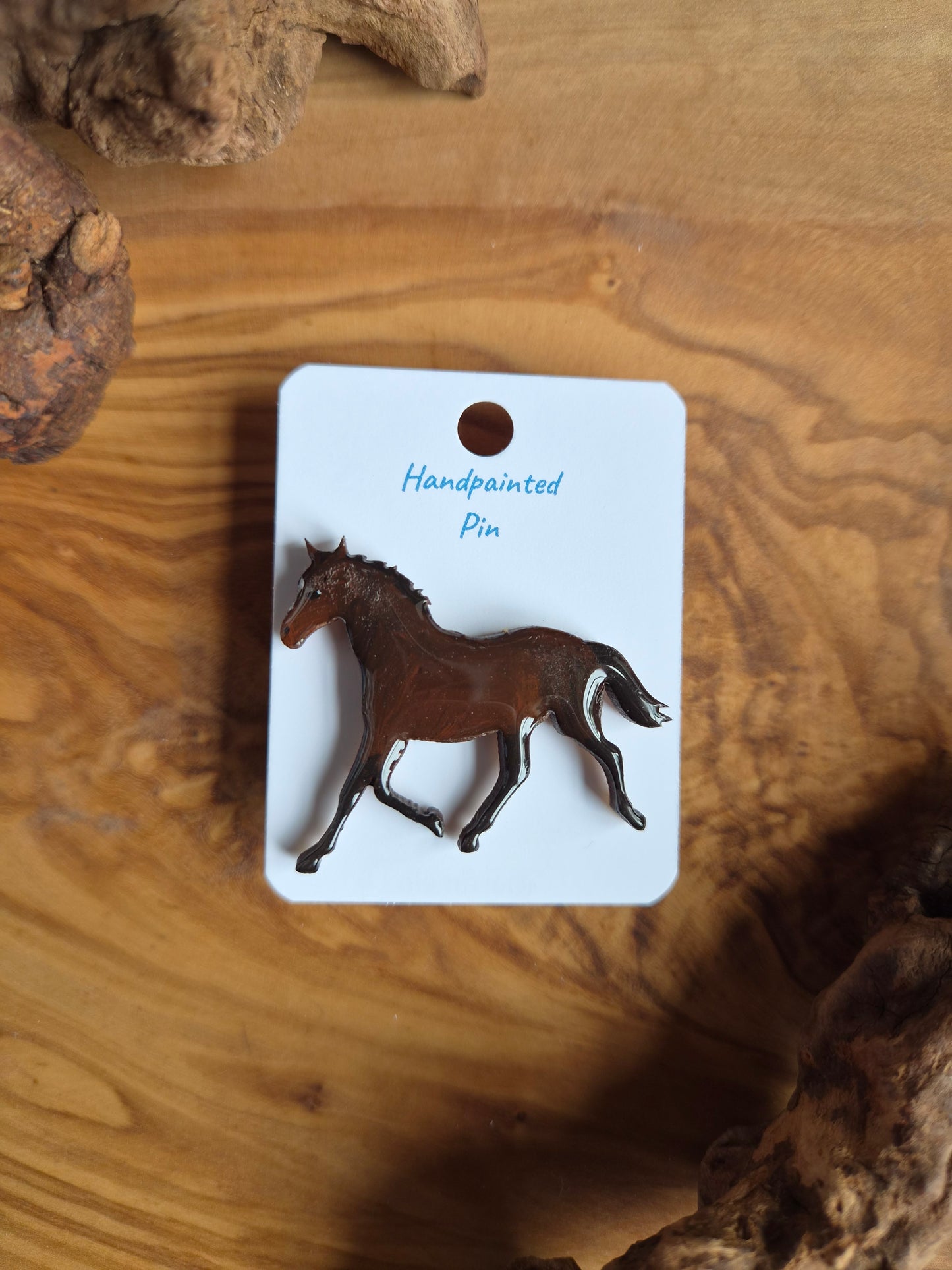 Hand-painted horse shaped wooden pin badge.  Dark bay colour