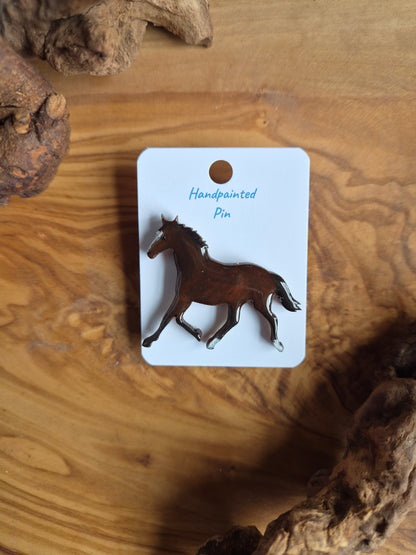 Hand-painted horse shaped wooden pin badge.  Dark bay colour with 2 socks and a blaze