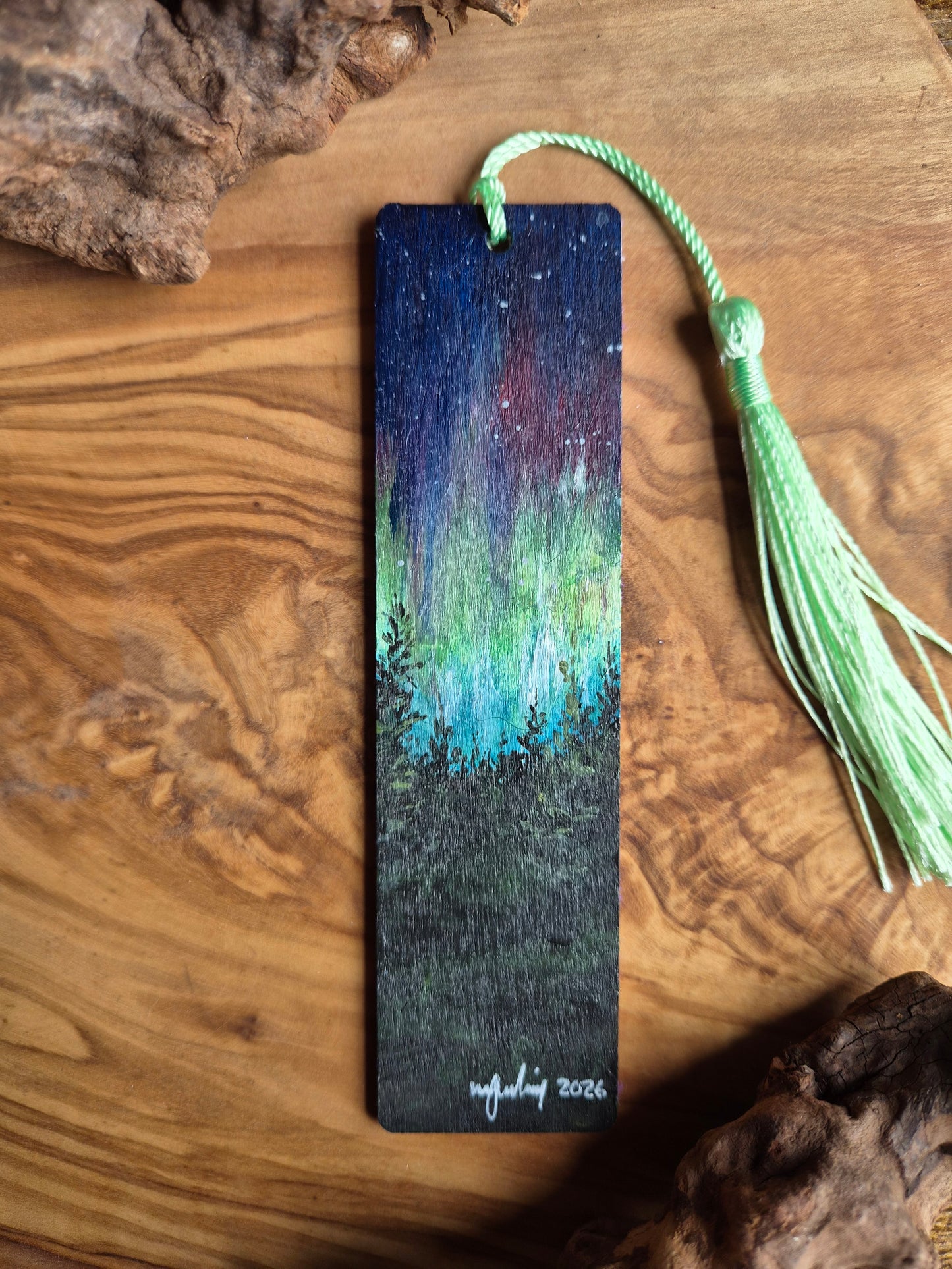 Hand-painted wooden bookmark of vibrant lively northern lights aurora borealis